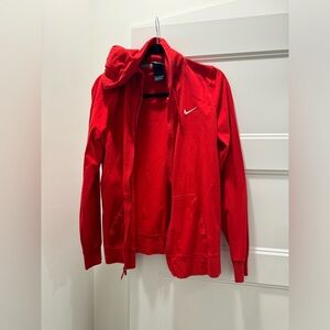 Women’s red Nike zip up hooded jacket